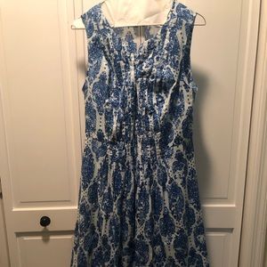Blue print dress with detachable slip. Dress is fit and flare.